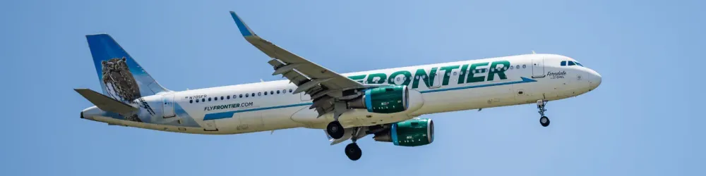 ORLANDO, FLORIDA - JUNE 29, 2022 : Frontier Airlines Airbus A321 commercial jet airplane in flight shortly before landing at the Orlando International Airport (MCO). Ferndale the Pygmy Owl jet plane.